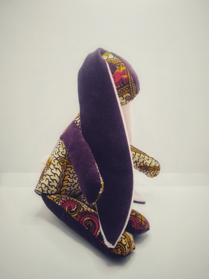 peluche animal lapin en wax assis de côté