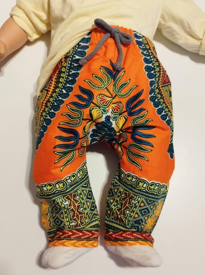 pantalon en super wax imprimé orange et bordeaux vue de face