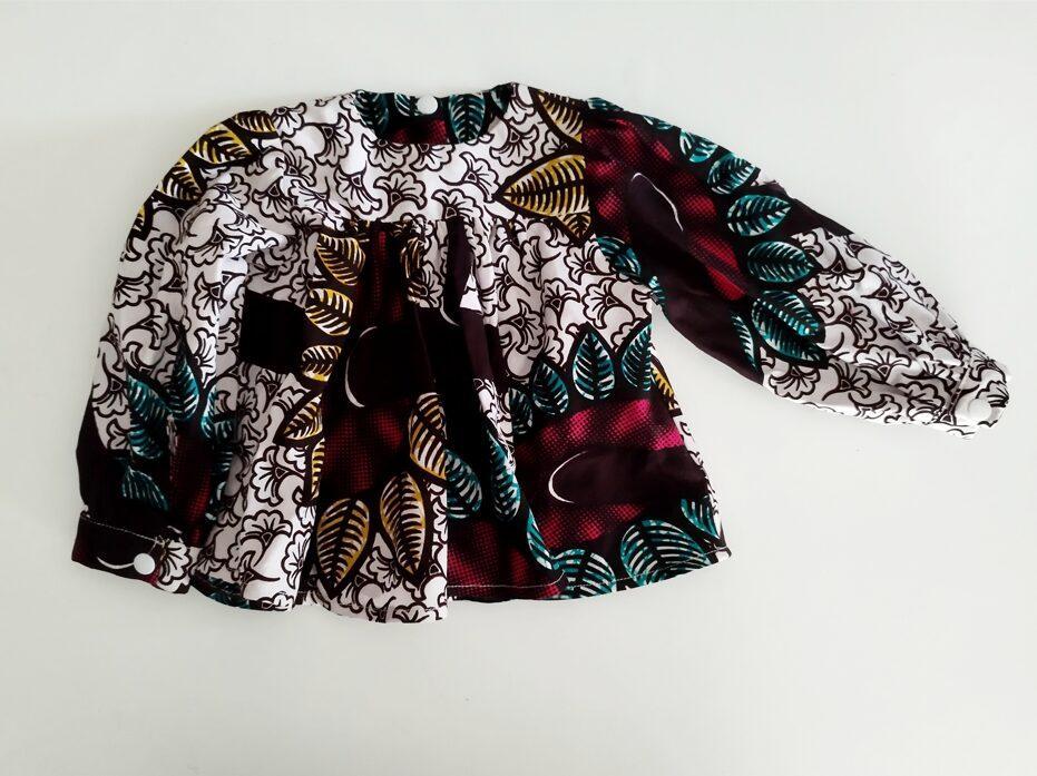 Blouse pour bébé en wax imprimé violet, bleu et marron